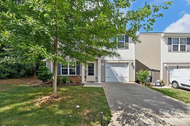 view of property hidden behind natural elements featuring a garage and a front yard