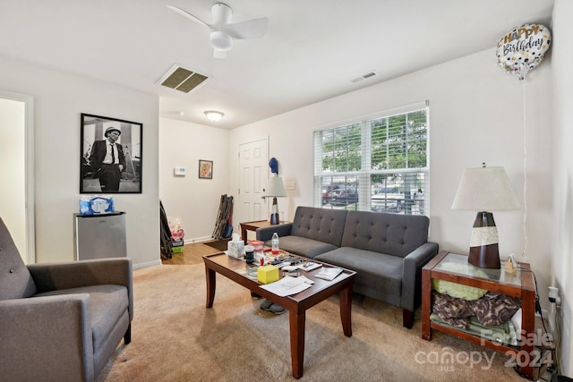 living room featuring ceiling fan and light colored carpet