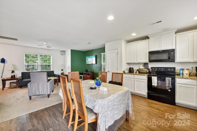 dining room featuring light wood-type flooring and ceiling fan