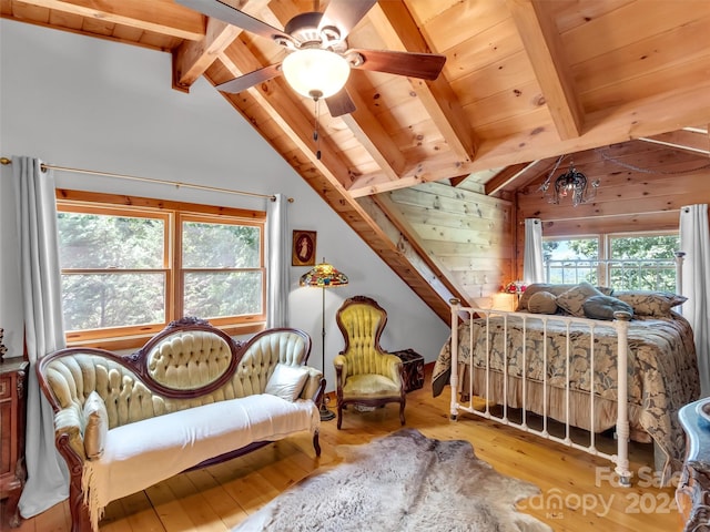 bedroom with wooden ceiling, vaulted ceiling with beams, multiple windows, and light wood-type flooring