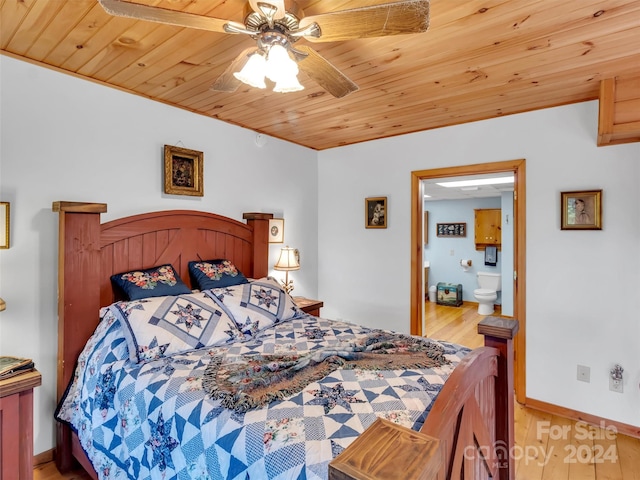 bedroom with ceiling fan, ensuite bath, hardwood / wood-style floors, and wooden ceiling