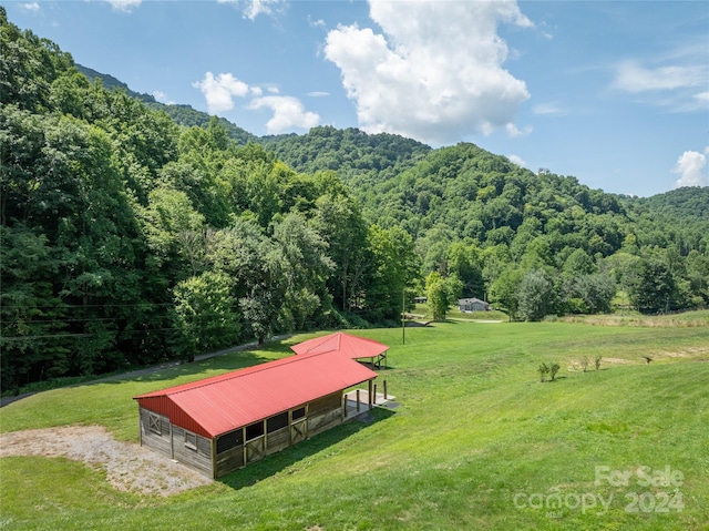 view of property's community with an outdoor structure