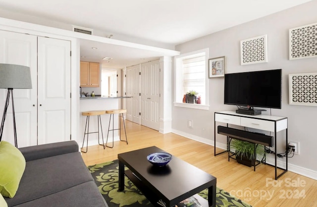 living room with light hardwood / wood-style floors