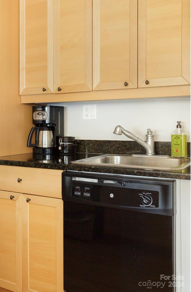 kitchen featuring black dishwasher, light brown cabinetry, and sink