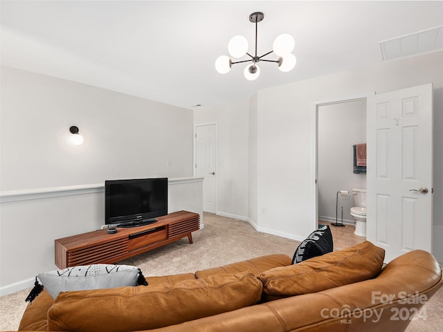 living room featuring light carpet and a chandelier