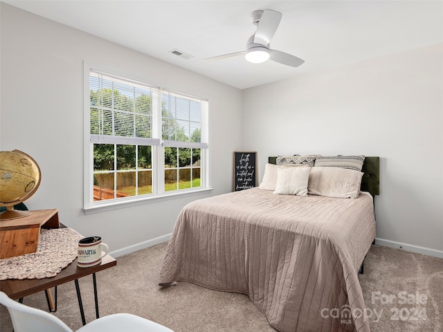 carpeted bedroom with ceiling fan