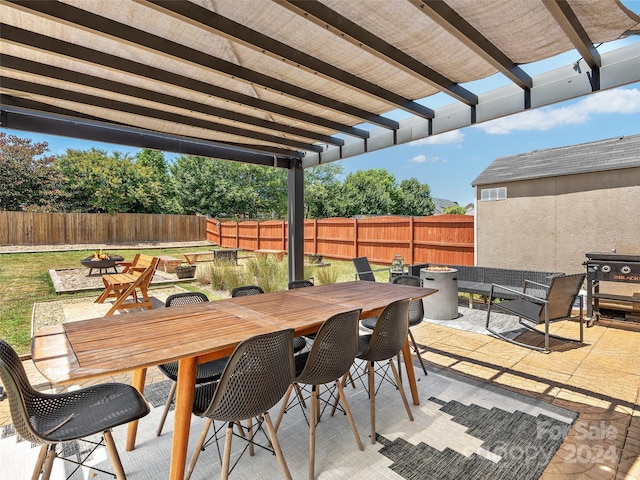 view of patio with an outdoor fire pit and a pergola