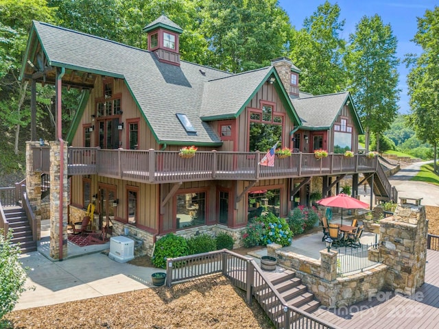 rear view of property with a patio area and a deck