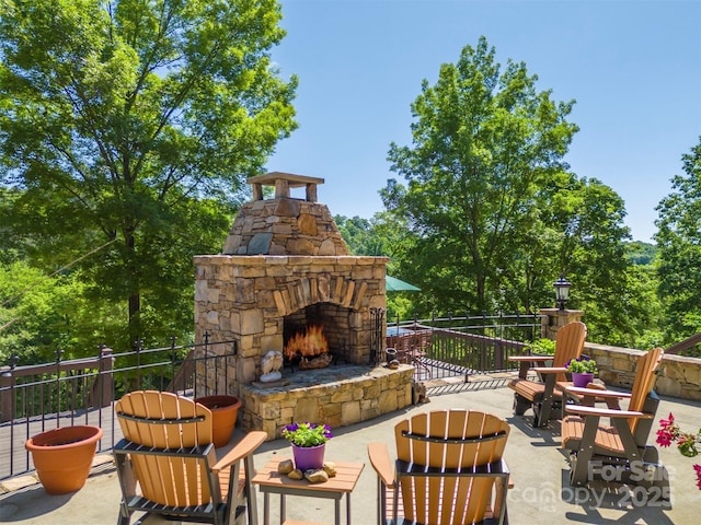 view of patio / terrace with an outdoor stone fireplace