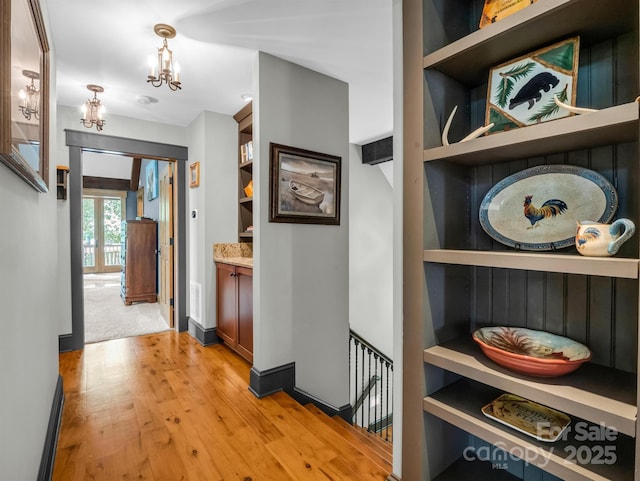 hall with light hardwood / wood-style floors