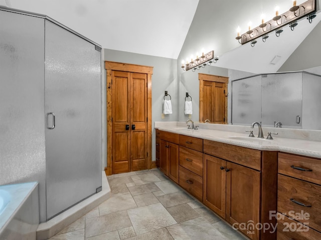 bathroom with vanity, plus walk in shower, and vaulted ceiling