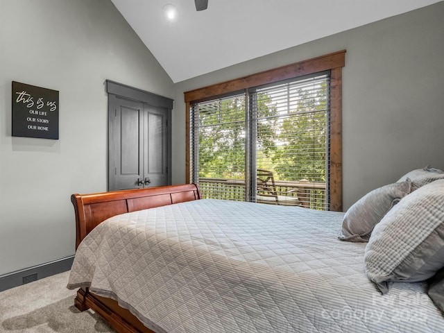 bedroom featuring carpet floors, vaulted ceiling, and ceiling fan