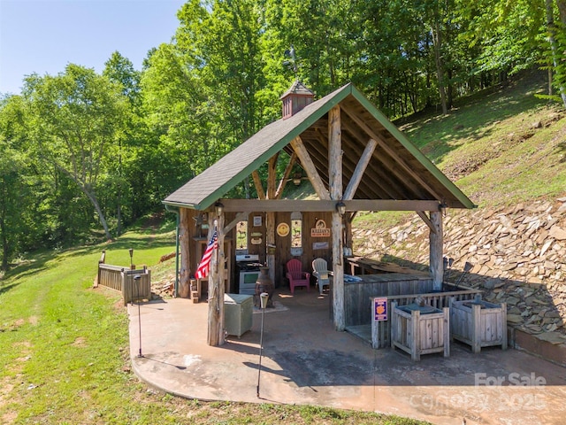 view of patio / terrace featuring a gazebo and area for grilling