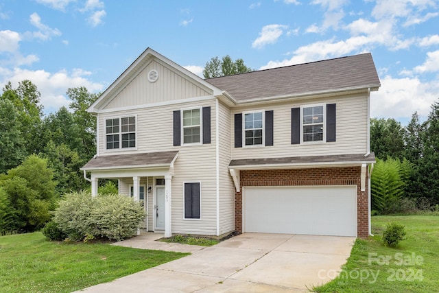 view of front facade featuring a garage and a front lawn