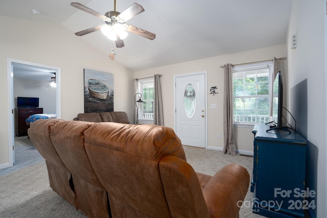 living room with light colored carpet, vaulted ceiling, and ceiling fan