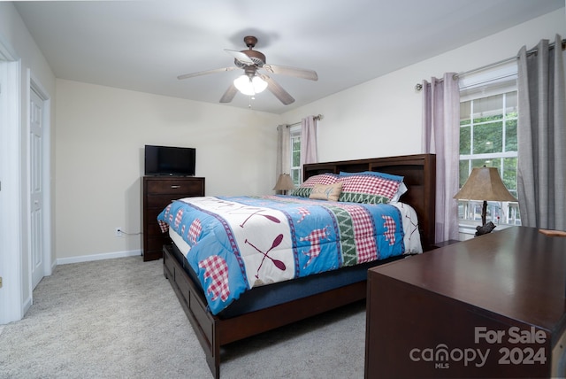 carpeted bedroom with ceiling fan