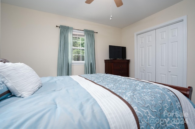 bedroom with ceiling fan and a closet