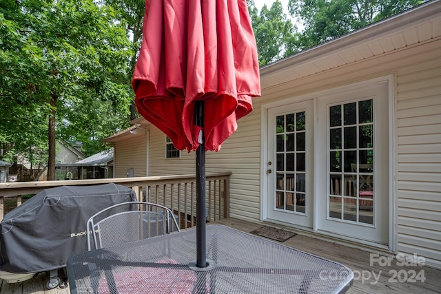 wooden deck with area for grilling