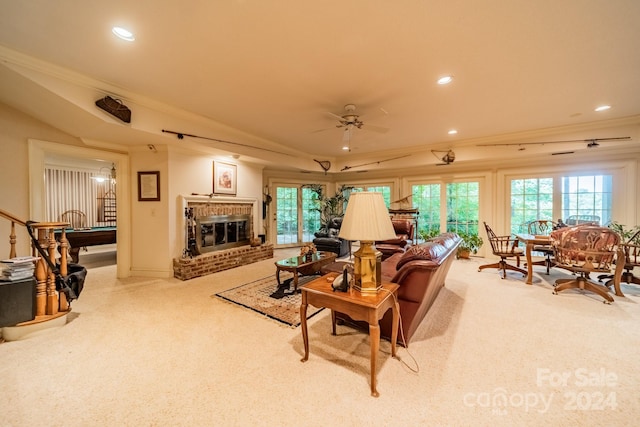 carpeted living room with a fireplace, ceiling fan, and billiards