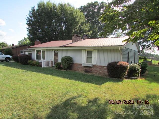 exterior space with a front lawn