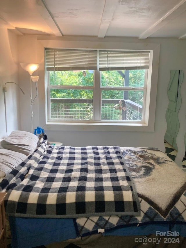 bedroom featuring multiple windows