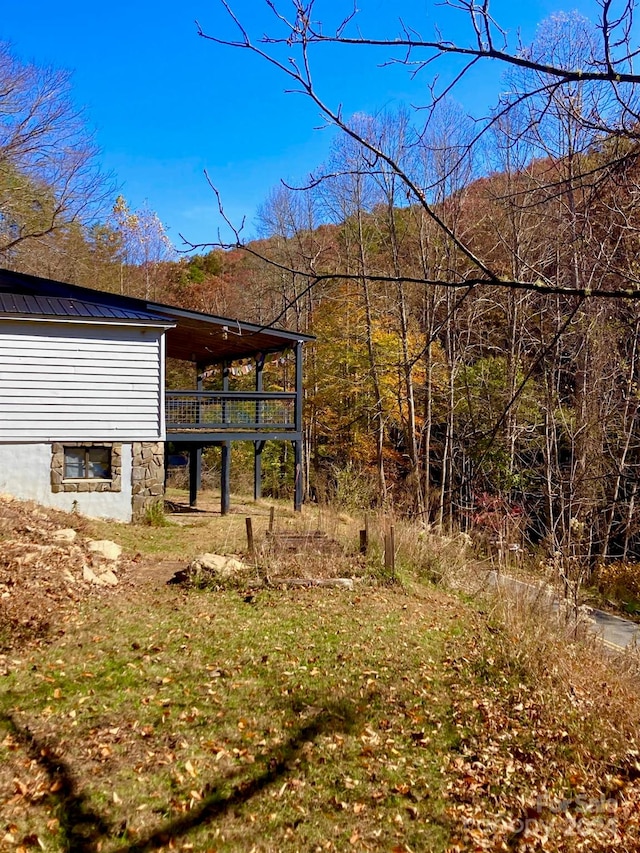 view of yard featuring a wooden deck