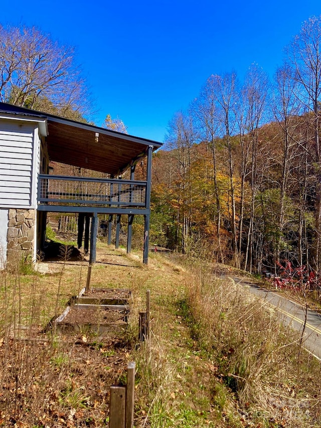 view of yard with a wooden deck