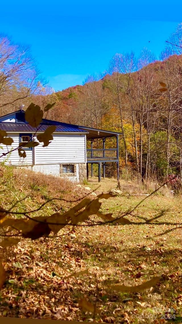 view of side of home featuring a mountain view