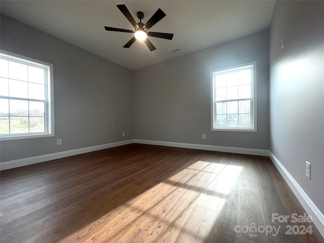 unfurnished room featuring hardwood / wood-style flooring, plenty of natural light, and ceiling fan