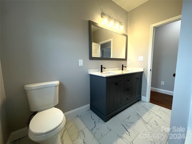 bathroom with vanity and toilet