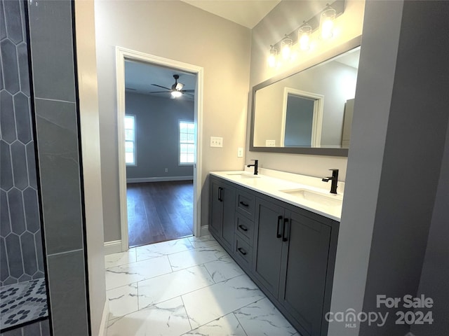 bathroom with ceiling fan, vanity, and hardwood / wood-style flooring