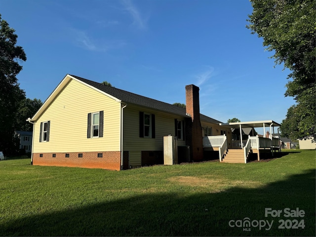 view of property exterior with a yard