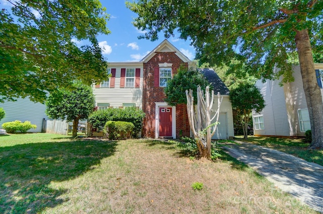 view of front facade featuring a front yard and a garage