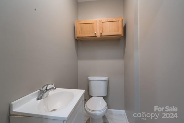 bathroom with toilet and vanity