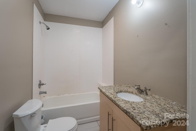 full bathroom featuring washtub / shower combination, tile patterned floors, vanity, and toilet