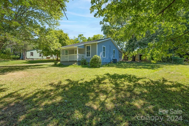 exterior space with a lawn and a porch