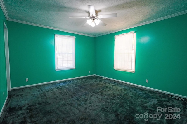 carpeted empty room with crown molding, a textured ceiling, and ceiling fan