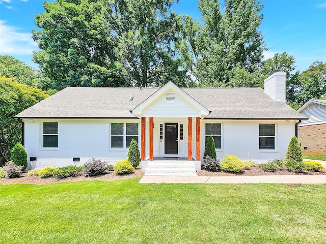 ranch-style home with a front lawn