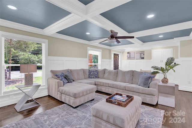 living room featuring ornamental molding, wood-type flooring, beam ceiling, and coffered ceiling