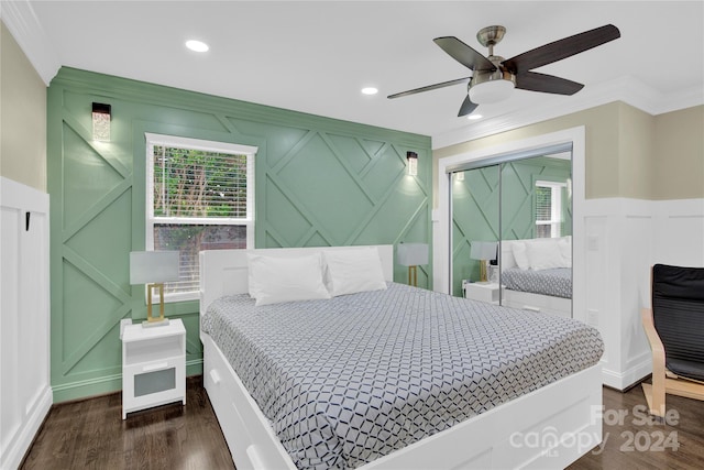 bedroom featuring ceiling fan, crown molding, and dark hardwood / wood-style floors