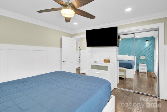 bedroom featuring ceiling fan, dark hardwood / wood-style floors, and ornamental molding