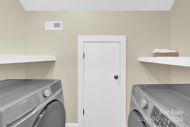 laundry area with washer and clothes dryer