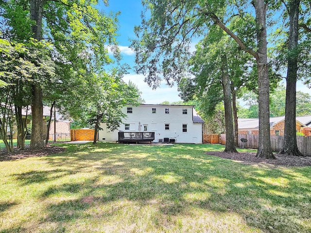 view of yard with a wooden deck