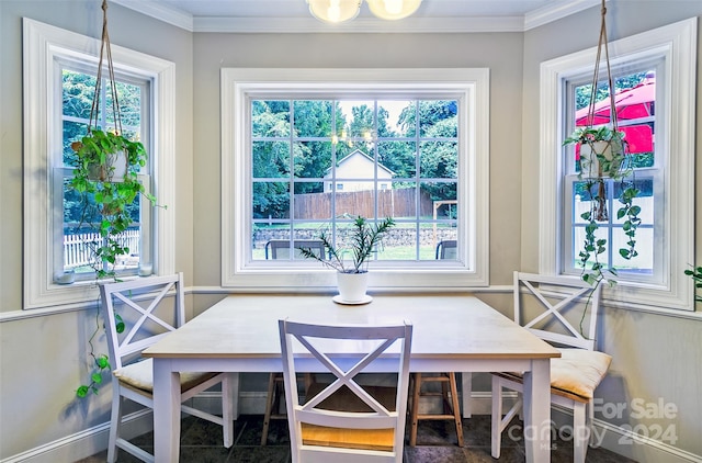 dining area featuring breakfast area and ornamental molding