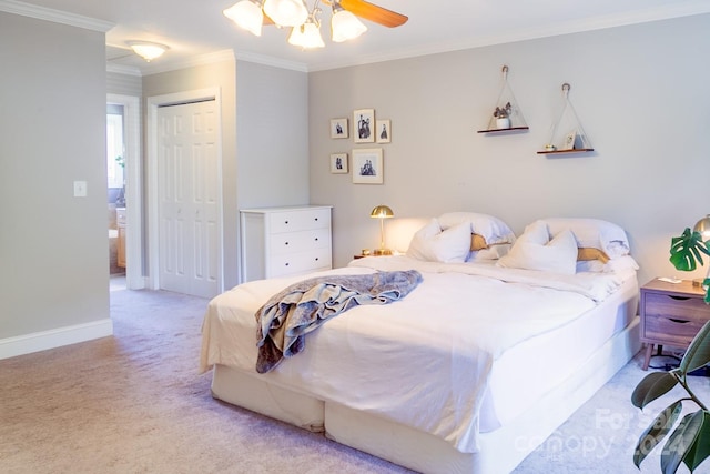 bedroom with ceiling fan, light colored carpet, a closet, and crown molding