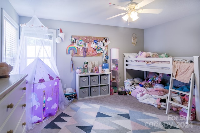 bedroom featuring light carpet and ceiling fan