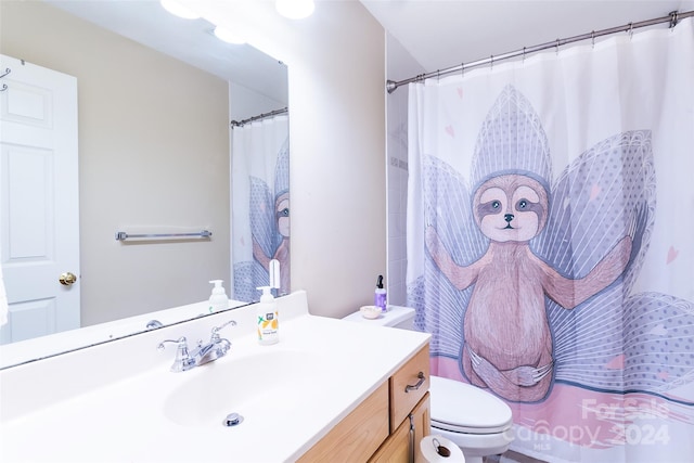 bathroom featuring toilet, walk in shower, and vanity