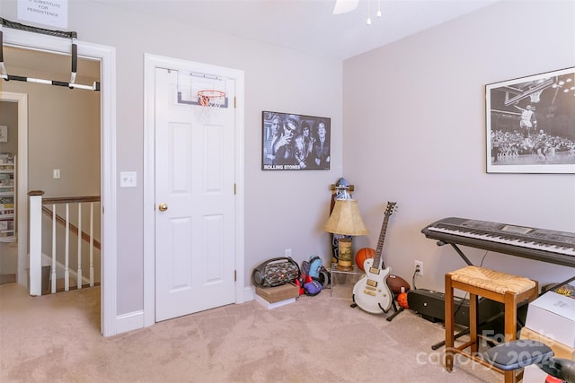 misc room with ceiling fan and light colored carpet