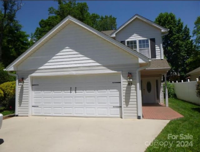 view of front of property with a garage