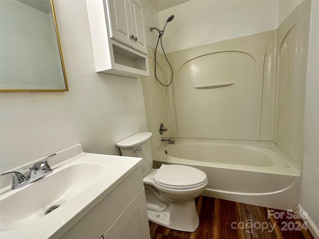 full bathroom featuring toilet, a textured ceiling, shower / tub combination, wood-type flooring, and vanity